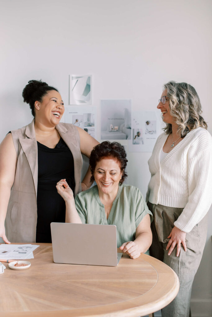 Three middle-aged women networking 